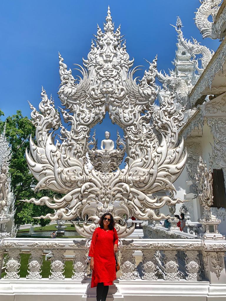 With one of the sculptures in Wat Rong Khun