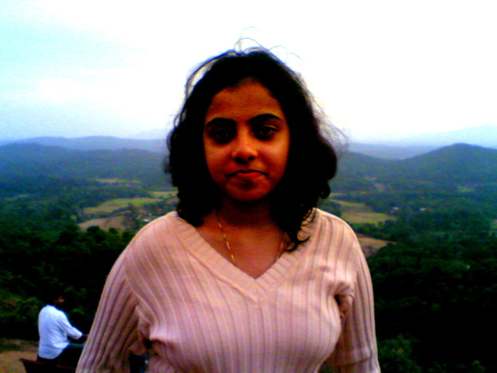 a girl standing at Raja's seat in Coorg